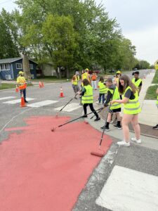 Pleasantview Elementary School students painting the pavement as part of a SRTS demonstration project in Sauk Rapids.